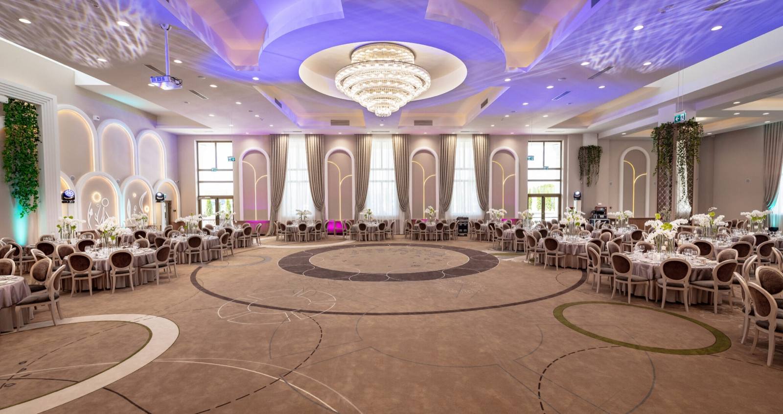 The grand hall, with chandeliers and arches
