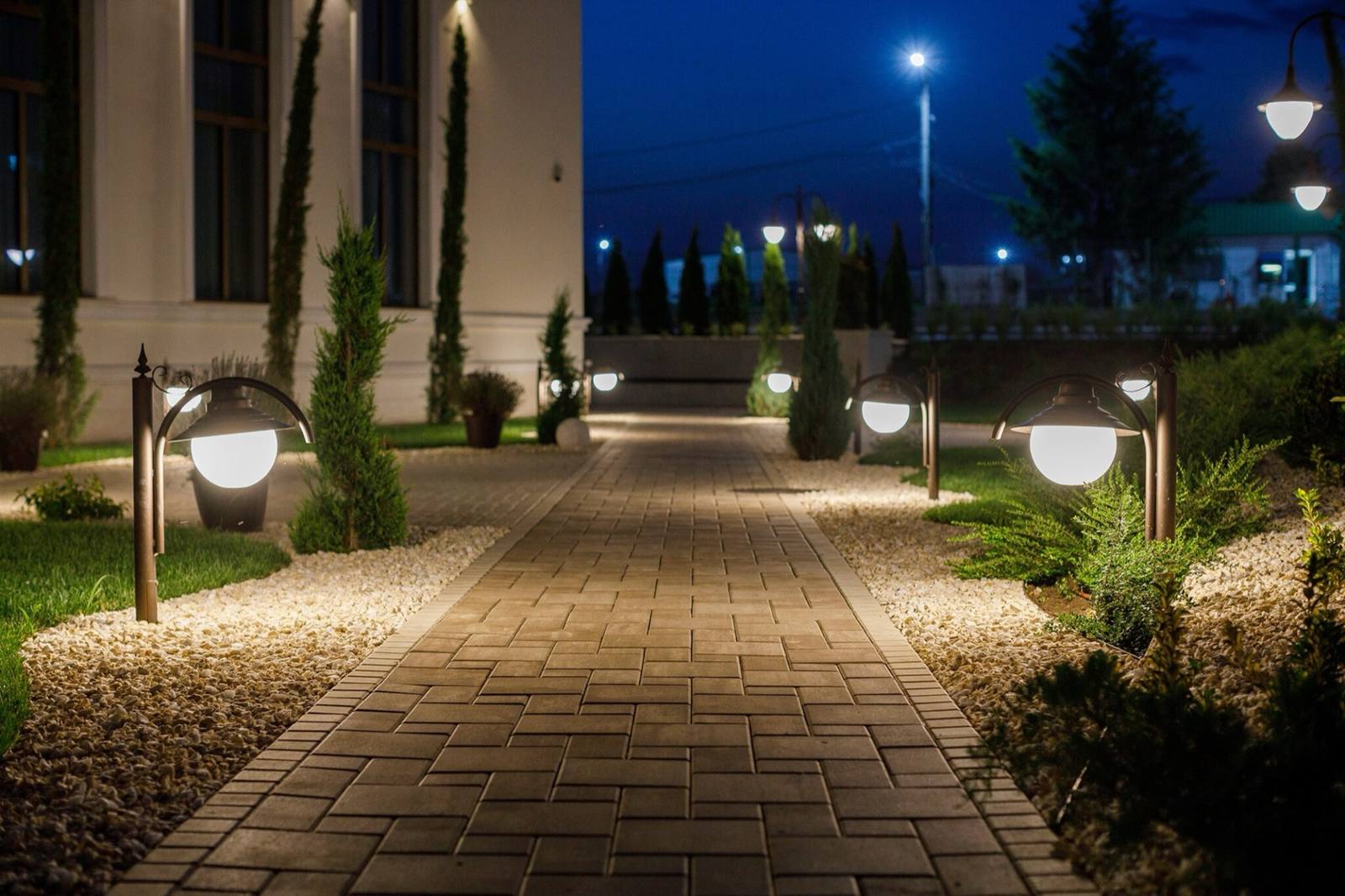The Coroana estate at night, with lit walkways